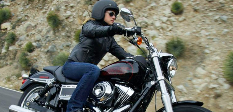 Woman on Harley Dyna Glide motorcycle