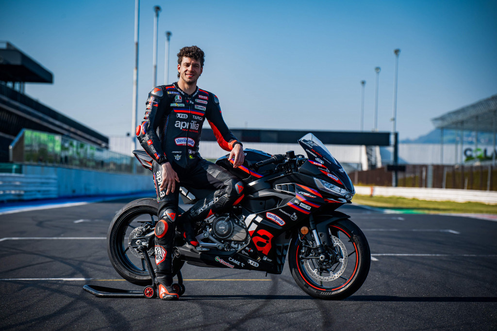 Aprilia MotoGP racer Marco Bezzecchi with the RS 457 GP Replica